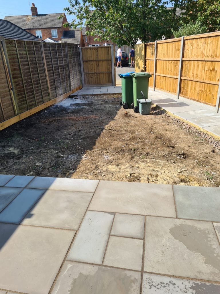 backyard-patio-installation-near-completed-with-paving-slabs