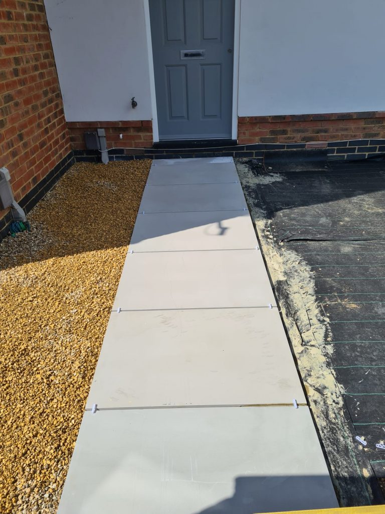 front-pathway-laying-with-grey-slabs