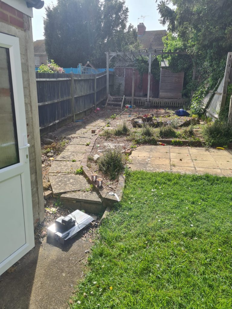 overgrown-garden-before-clearance-patio-and-shed